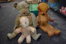 Two mid 20th century straw filed light and dark yellow plush Teddy Bears having replacement eyes,