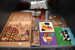 A selection of vintage toys and puzzles including a Vulcan Senior Sewing Machine, Galt Toys wooden