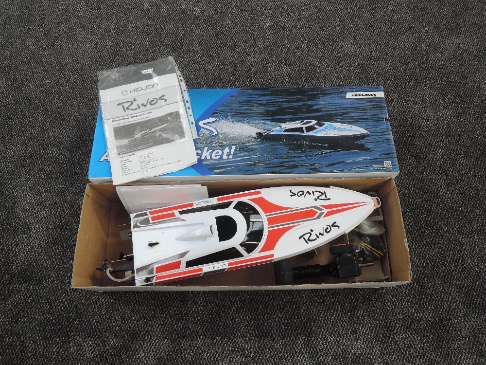 A Helion Firelands radio controlled model boat, Rivos a Water Rocket in original box