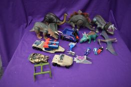 A selection of 1980's Dino Riders and Bluebird plastic vehicles and figures