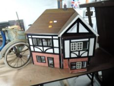 A traditional wooden two storey Dolls House, part furnished along with a 1990's Mattel Sindy style