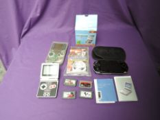 A Nintendo Game Boy Advance SP Classic Nes Edition with four game cartridges, Moto GP THQ, Zelda,