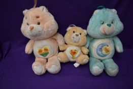 Three 1980's Care Bears, Friend Bear, Bedtime Bear both heights 32cm and Champ Bear height 18cm