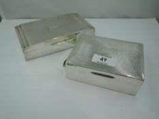 Two HM silver cigarette boxes, both having engine turned decoration and plain cartouches, both AF,