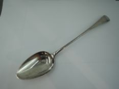 A Georgian silver basting spoon of Old English form bearing monogram to terminal, Newcastle 1807,