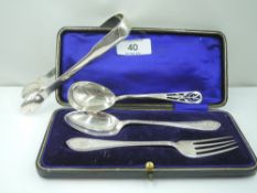 A cased child's HM silver spoon and fork bearing monogram to terminals, an HM silver artisan