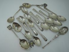 A selection of HM silver coffee and teaspoons including two sets of six and five souvenir spoons,