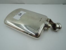 A silver hip flask of plain form having a baton fastening lid, Sheffield, date mark worn, James