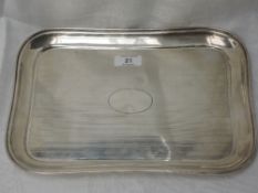 An HM silver dressing table tray having raised rim and engine turned stripe decoration and plain