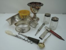 A small selection of HM silver including chatelaine pencil, napkin rings, egg cup, pepperettes