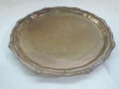 An Irish silver salver of circular form having Celtic moulded decoration to edge of pie crust rim,