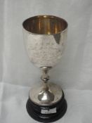 A silver goblet trophy having beaded foot and stem with presentation inscription regarding East