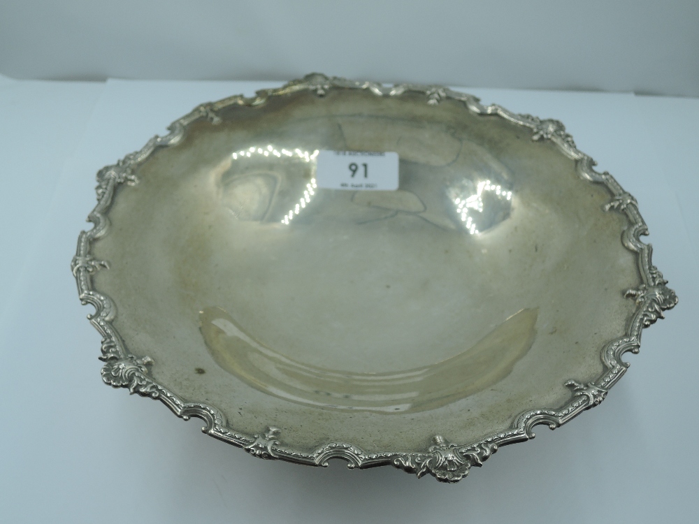 A silver tazza of circular form having moulded and shaped decorative rim and circular pedestal foot,