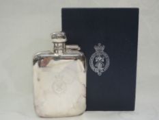 A silver hip flask of traditional form having bayonet clasp hinged lid and bearing Royal & Ancient