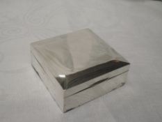 A silver cigarette box of plain square form, Birmingham 1965, Harman Brothers, GW approx 220g