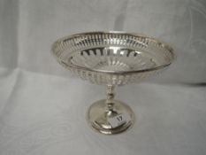 A silver tazza having gallery style pierced decoration, bamboo style column pedestal to circular