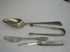 A Georgian silver table spoon of Old English form bearing monogram to terminal, Exeter 1810,