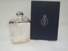 A silver hip flask of traditional form having bayonet clasp hinged lid and bearing Royal & Ancient