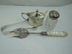 A Victorian silver pickle fork having engraved and pierced decoration and a mother of pearl