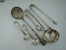 A selection of Georgian silver flatware including an ornately decorated sauce ladle, London 1778,