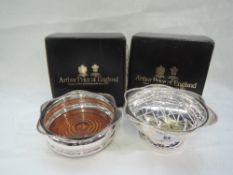 A silver plated bottle coaster and rose bowl of traditional forms, by Arthur Price, both as new with