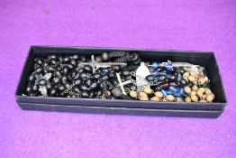 A small selection of Catholic rosary beads and charms