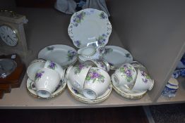 A part tea service by Sutherland HM bone China with transfer print design