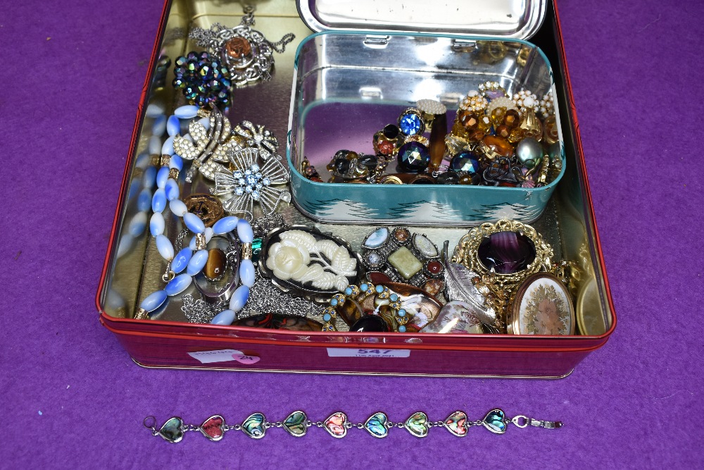 A selection of costume jewellery brooches, earrings and pendants including enamelled, Royal Navy,
