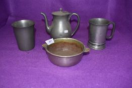 A collection of pewter and similar items including tankard with touch marks and antique porringer.