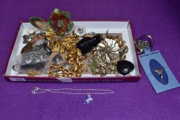 A selection of costume jewellery including brooches, earrings, Napier gold plated necklaces, etc
