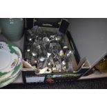 A box full of vintage flatware.