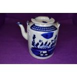 A Chinese export hard paste tea pot with blue and white decoration