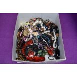 A large selection of costume jewellery necklaces including metal, wood, simulated pearls, cord etc