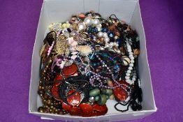 A large selection of costume jewellery necklaces including metal, wood, simulated pearls, cord etc