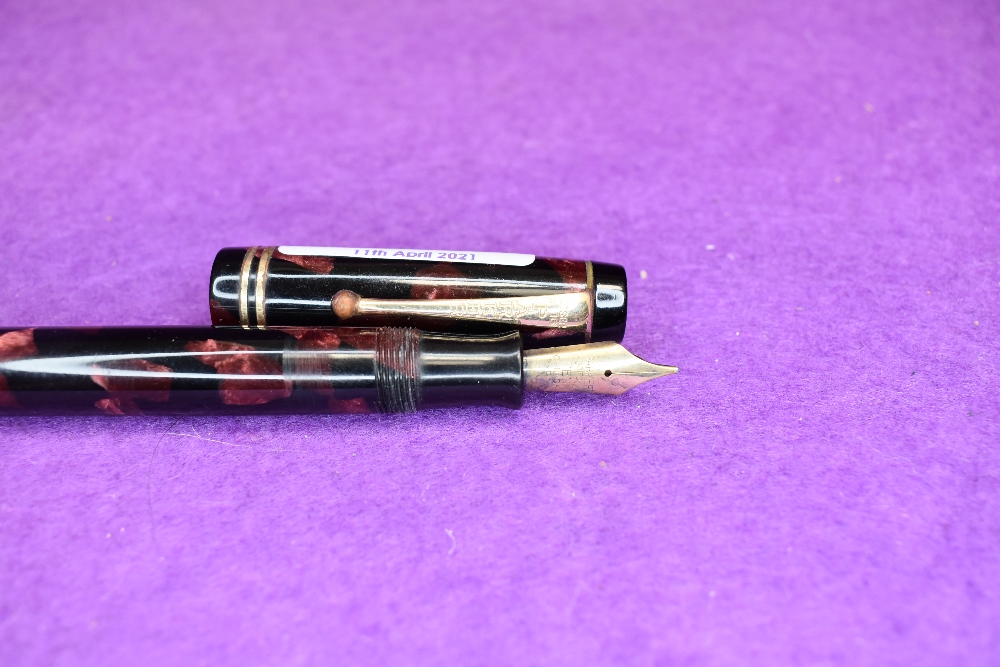 A Parker Duofold in red marble with two gold bands to cap slight wear to clip - Image 2 of 2