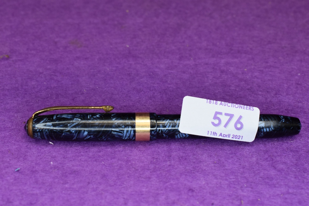 A Conway Stewart 27 leverfill fountain pen in blue marble with broad single gold band to cap