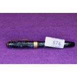 A Conway Stewart 27 leverfill fountain pen in blue marble with broad single gold band to cap