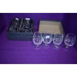 six Waterford crystal wine glasses, two of one style and four in another.