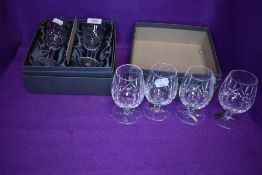 six Waterford crystal wine glasses, two of one style and four in another.