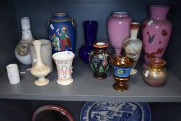 A selection of antique and later vases including porcelain glass and bisque hand decorated