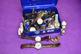 A cash tin containing a selection of costume jewellery wrist watches including Swatch, Rotary,