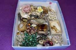 A selection of costume jewellery brooches of various forms including vintage and modern