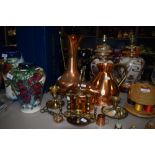 A selection of brass and copper wares including large water jugs