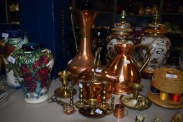 A selection of brass and copper wares including large water jugs