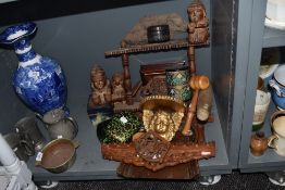 A collection of vintage treen including boxes, rolling pin and intricately carved items.