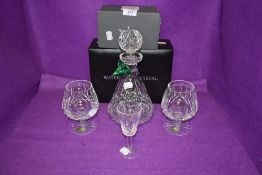 A selection of clear cut crystal glass wares by Waterford including decanter brandy glasses and