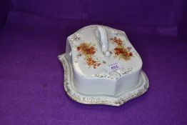 A Grimwades cheese dish having floral transfer pattern and gilt detailing, also included is a