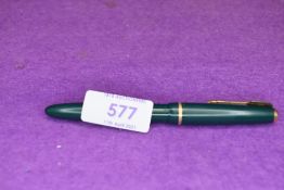 A Parker Slimfold vacuum fill fountain pen in forest green with single narrow decorative band to the