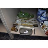 A selection of dressing table items including razor brush set and green glass