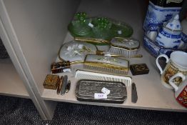 A selection of dressing table items including razor brush set and green glass
